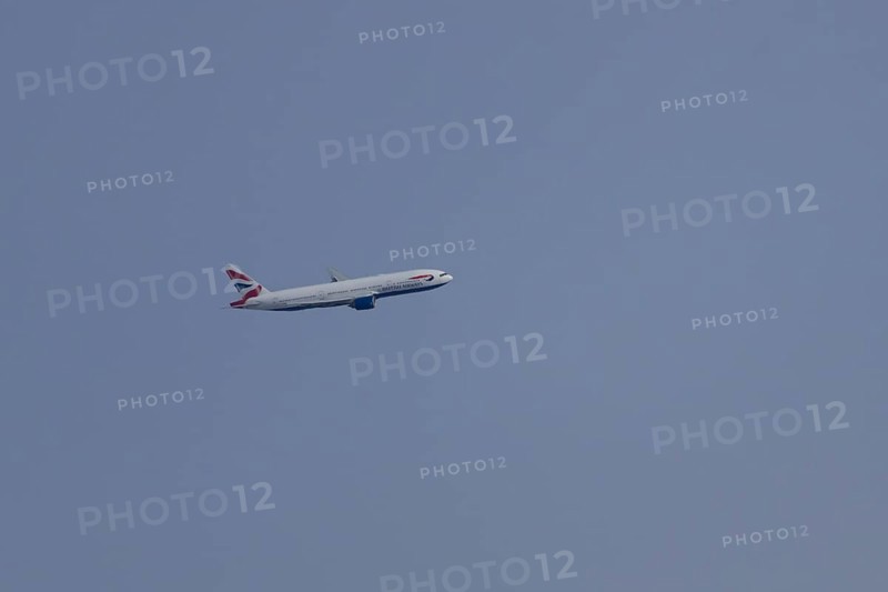 Boeing 787-9 Dreamliner jet passenger aircraft of British Airways airlines in flight in a blue sky, London, England, United Kingdom