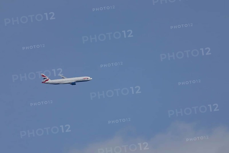 Boeing 787-9 Dreamliner jet passenger aircraft of British Airways airlines in flight in a blue sky, London, England, United Kingdom