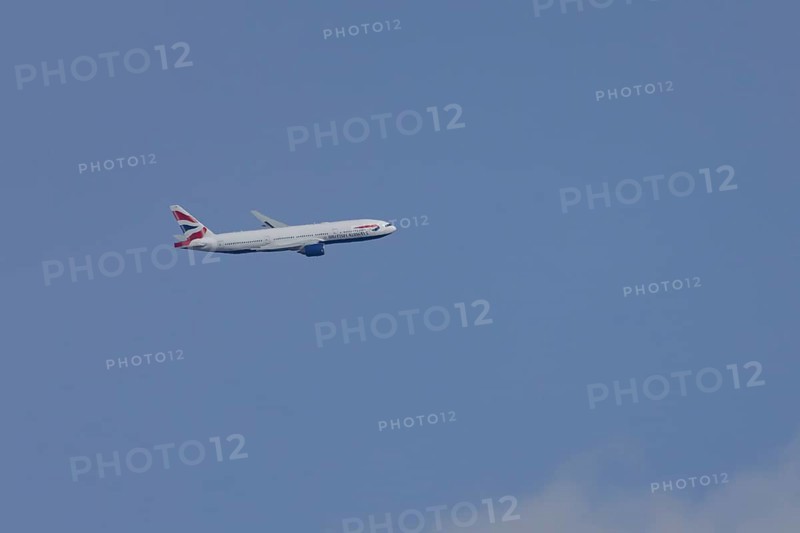 Boeing 787-9 Dreamliner jet passenger aircraft of British Airways airlines in flight in a blue sky, London, England, United Kingdom