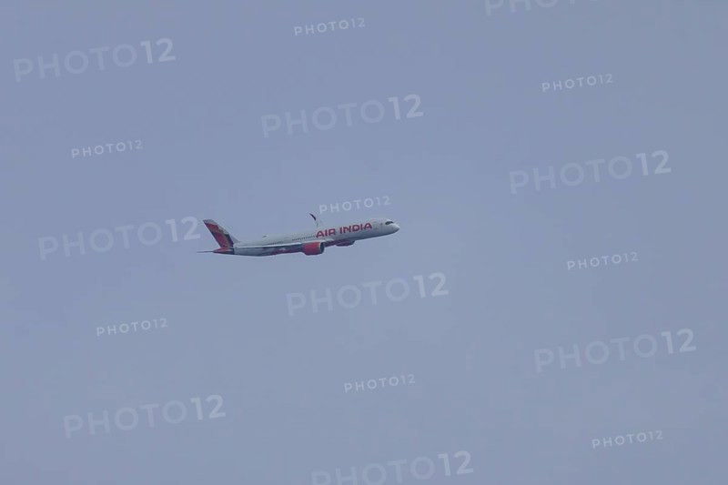 Airbus jet passenger aircraft of Air India airways in flight in a blue sky, London, England, United Kingdom