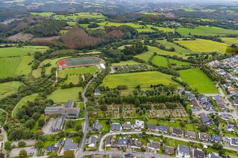 Aerial view, meadows and fields at Klevinghauser Straße between cemetery and sports field as well as St. Jacobus secondary school in Breckerfeld, Sauerland, North Rhine-Westphalia, Germany, burial site, education, educational institution, Breckerfeld, DE, Europe, cemetery, football pitch, memorial site, Gottesacker, graves, burial ground, educational institution, aerial photograph, aerial photography, aerial photography, resting place, school, sports facilities, sports field, sports facility, overview, bird's-eye view, overview