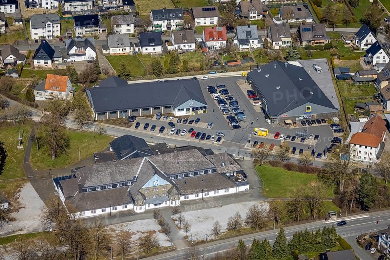 Aerial view, Schützenhalle, EDEKA Brilon, ALDI Brilon, local supply centre, Brilon, Sauerland, North Rhine-Westphalia, Germany, Aldi supermarket, DE, Edeka supermarket, shopping markets, shopping place, shopping centre, Europe, hall, aerial view, aerial photography, aerial photography, St. Hubertus-Schützenbruderschaft, overview, bird's-eye view, birds-eyes view, overview