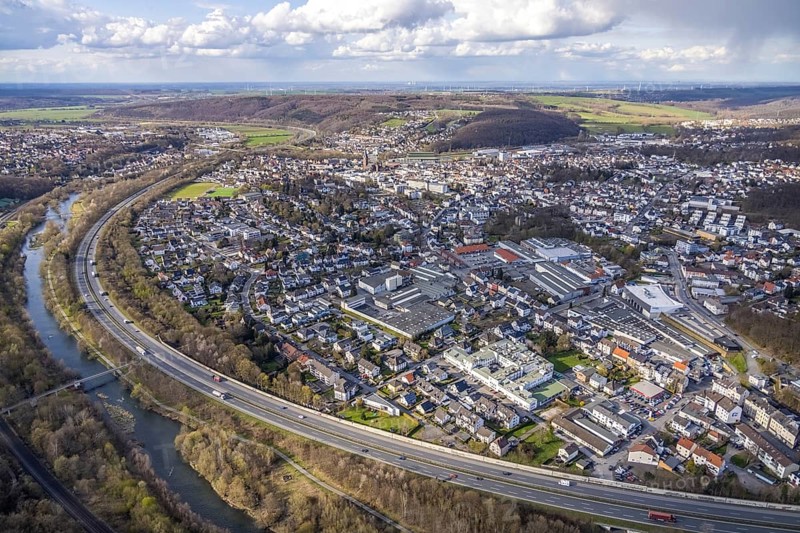 Aerial view, industrial area with Arnsberger Metallwerke, Ruhr valley cycle path and Ruhr pedestrian bridge with river Ruhr and motorway A46, town view Neheim, Arnsberg, Sauerland, North Rhine-Westphalia, Germany, City, DE, Dom, Europe, distant view, commercial enterprises, commercial area, commercial location, commercial use, industrial area, industrial location, aerial view, aerial photography, aerial photography, townscape, city area, city centre, overview, bird's eye view, bird's eye view, overview
