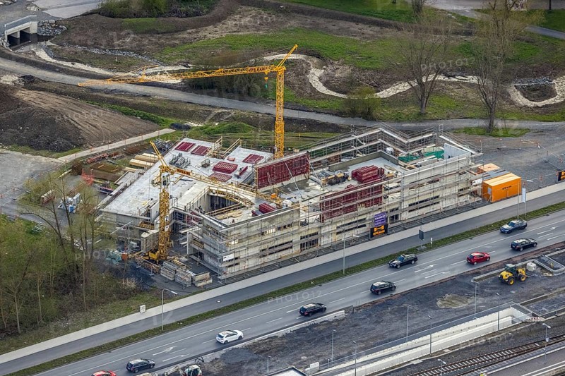 Aerial view, construction site and new construction of vocational training centre on the educational campus on Kleinbahnstraße, Hüsten, Arnsberg, Sauerland, North Rhine-Westphalia, Germany, construction work, construction area, building site, building plots, construction project, construction site, education, educational institution, DE, Europe, teaching institute, aerial view, aerial photography, aerial photography, new construction, school, overview, bird's-eye view, overview, new course of stream, tree stream