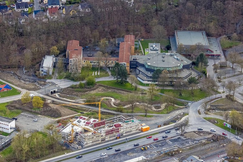 Aerial view, construction site and new construction of vocational training centre on the educational campus on Kleinbahnstraße, Franz-Stock-Gymnasium, cultural centre, Hüsten, Arnsberg, Sauerland, North Rhine-Westphalia, Germany, construction work, construction area, building site, building plots, construction measure, construction project, construction site, education, educational institution, DE, Europe, teaching institute, aerial view, aerial photography, aerial photography, new construction, school, overview, bird's-eye view, overview, new course of stream, tree stream
