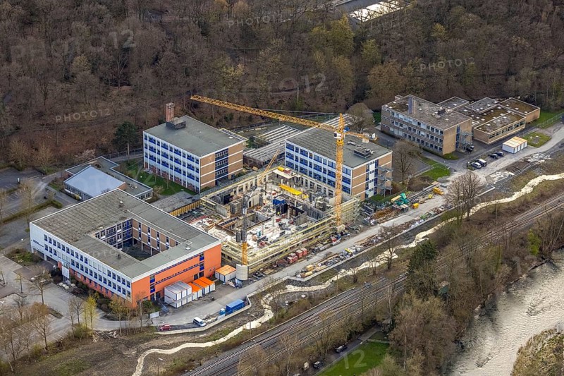 Aerial view, construction site and new building at Berufskolleg Berliner Platz, Hüsten, Arnsberg, Sauerland, North Rhine-Westphalia, Germany, construction work, construction area, construction site, building plots, construction crane, construction measure, construction project, construction site, education, educational institution, DE, Europe, college school, teaching institute, aerial view, aerial photography, aerial photography, new building, school, overview, bird's-eye view, overview