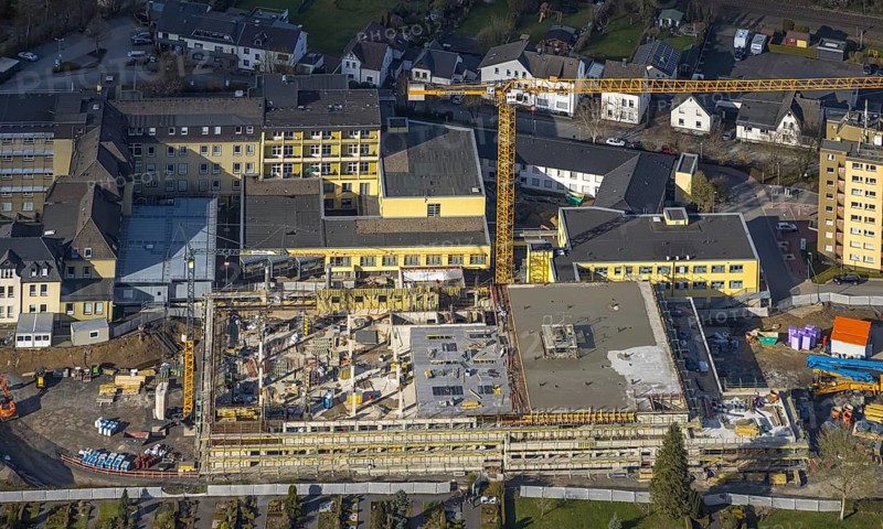 Aerial view, construction site and new building at Hochsauerland Clinic, Hüsten, Arnsberg, Sauerland, North Rhine-Westphalia, Germany, construction work, construction area, construction site, building plots, construction crane, construction measure, construction project, construction site, DE, Europe, healthcare, Hochsauerlandkreis, hospital, clinic, clinic centre, hospital, aerial view, aerial photography, aerial photography, medical facility, medical aid, emergency service, overview, bird's eye view, birds-eyes view, overview, medical care