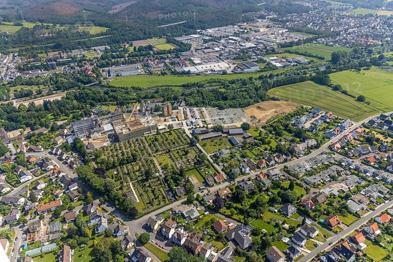 Aerial view, construction site and extension of Hochsauerland Karolinen-Hospital Hüsten, Hüsten, Arnsberg, Sauerland, North Rhine-Westphalia, Germany, construction work, construction area, building site, building plots, construction project, construction site, burial site, DE, Europe, cemetery, memorial, health care, Gottesacker, graves, burial ground, Hochsauerlandkreis, hospital, Kath. St. Petri cemetery, clinic, hospital, hospital centre, hospital, aerial view, aerial photography, aerial photography, medical facility, medical aid, new building, resting place, overview, bird's-eye view, bird's-eye view, overview, medical care