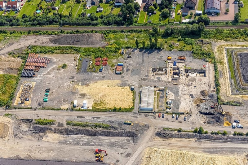 Aerial view, construction site for planned urban quarter Wasserstadt Aden on the site of the former Haus Aden colliery on the Datteln-Hamm Canal in Oberaden, Bergkamen, Ruhr area, North Rhine-Westphalia, Germany, construction work, construction area, building site, building plots, construction project, construction site, DE, Europe, canal, aerial view, aerial photography, aerial photography, new building, overview, bird's eye view, living and living, residential neighbourhood, birds-eyes view, overview