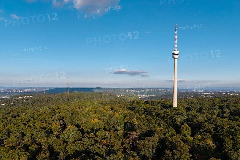 Sublime television tower above a green forest landscape with blue sky and clouds, Stuttgart-Degerloch, Baden-Württemberg, Germany