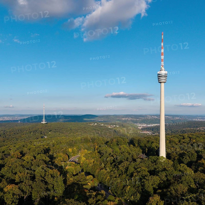 High television tower above lush greenery, soft clouds in the clear sky, Stuttgart-Degerloch, Baden-Württemberg, Germany