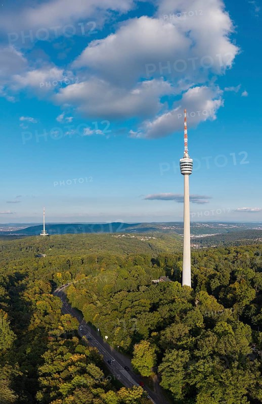 View of a television tower above a dense forest, surrounded by soft clouds in the sky, Stuttgart-Degerloch, Baden-Württemberg, Germany