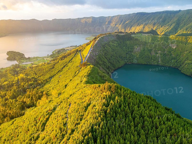 Lake Santiago and Blue Lake. Sete Cidades Caldera at Sunset. Lush Green Hills with Trees. Azores, Sao Miguel Island. Portugal. Aerial View