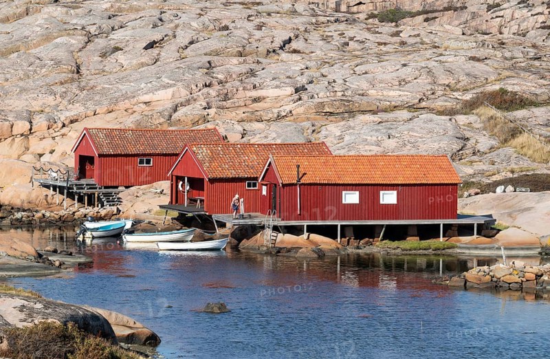 Falun red fishermen's huts by the sea, Bohus granite, rocky coast, Ramsvik, Ramsviklandet nature reserve, Bohuslän, Skagerrak, Sotenäs, Västra Götalands län, Sweden
