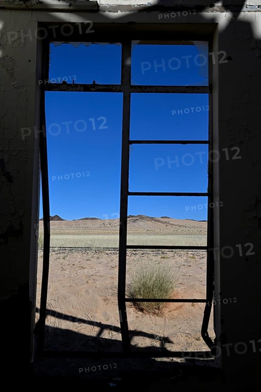 View from the window of the old German railway station of Garub into the Namib Desert, near Aus, Karas Region, Namibia