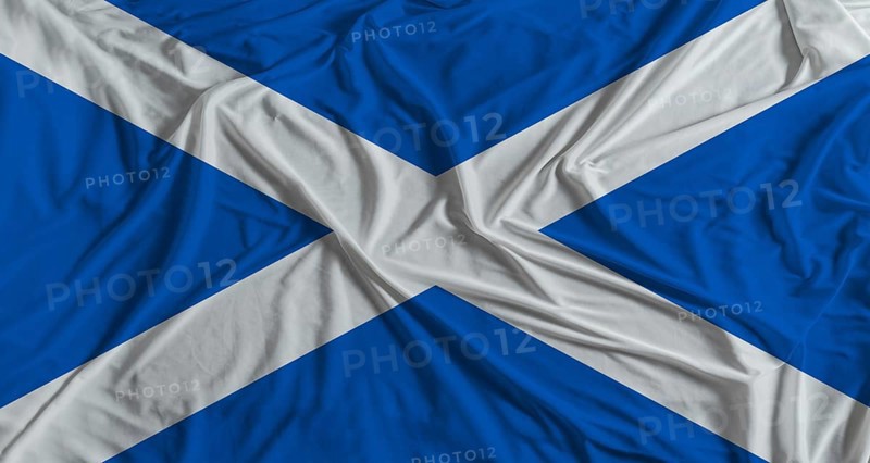 Scottish flag with fabric texture background. National flag of Scotland