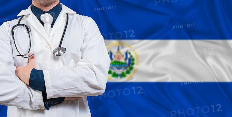 Male doctor with stethoscope on El Salvador flag. Doctor holding stethoscope on El Salvador flag
