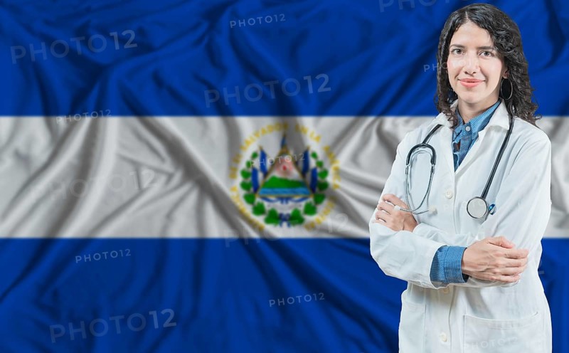 Salvadoran medicine and healthcare concept. Doctor close up against El Salvador flag background