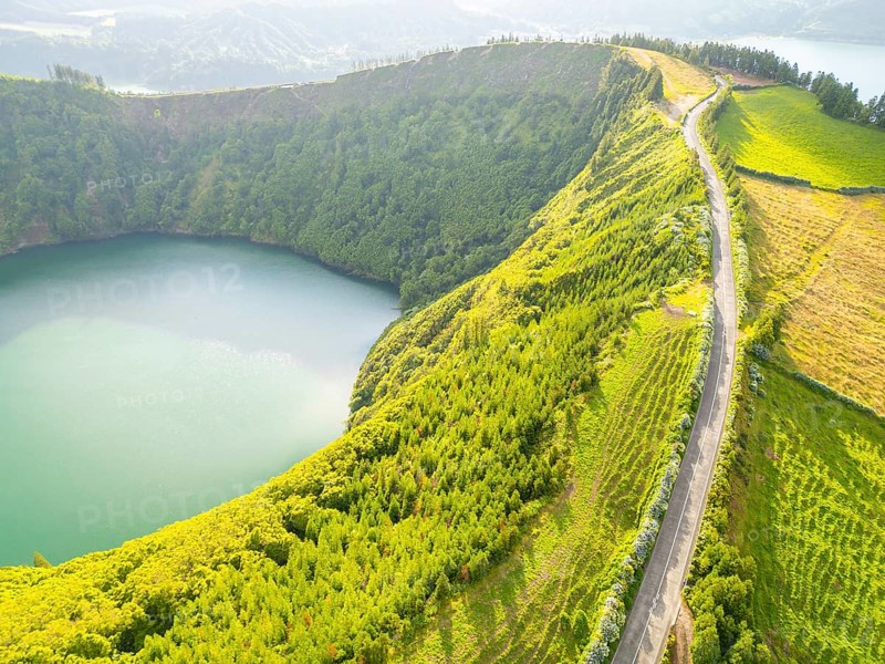 Road with Hydrangeas. Green Fields, Forest, Hills and Lake. Azores, Sao Miguel Island. Portugal. Aerial View