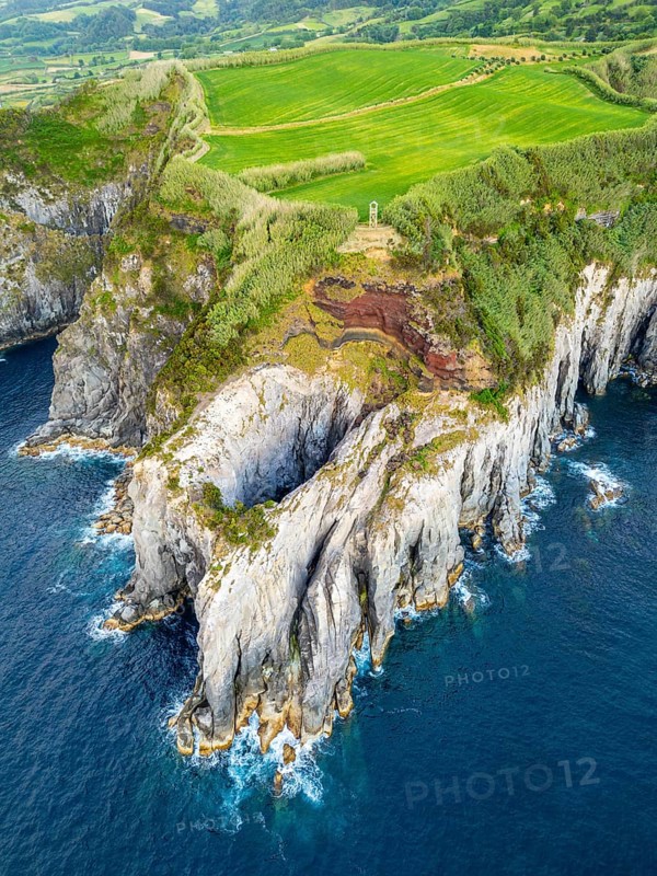 Cape Furado, Rocky Cliffs, Green Lush Fields, Pasturelands and Atlantic Ocean. Azores, Sao Miguel Island. Portugal. Aerial View