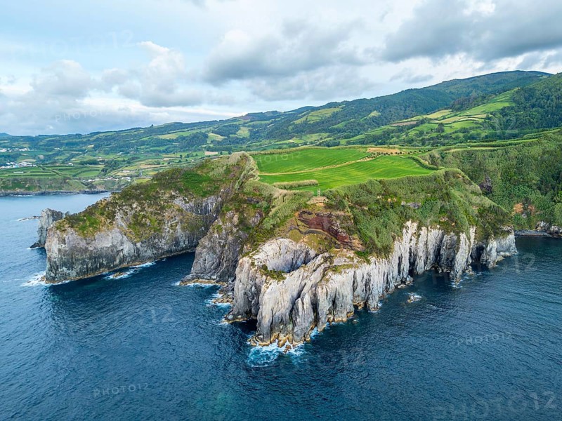 Cape Furado, Cliffs, Green Lush Hills, Fields, Pasturelands and Atlantic Ocean. Azores, Sao Miguel Island. Portugal. Aerial View