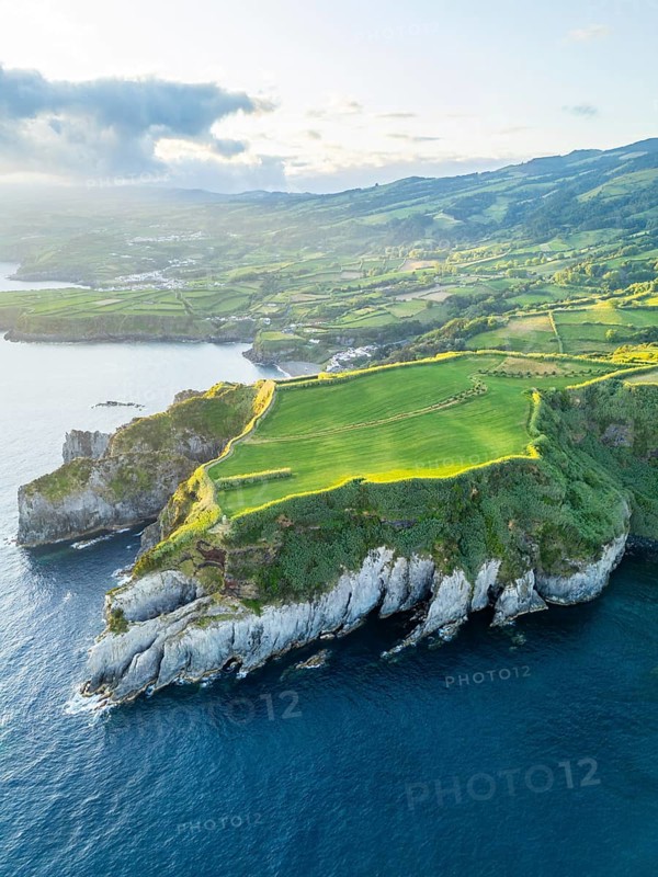 Cape Furado, Cliffs, Hills, Green Lush Fields, Pasturelands and Atlantic Ocean on Sunny Morning. Azores, Sao Miguel Island. Portugal. Aerial View