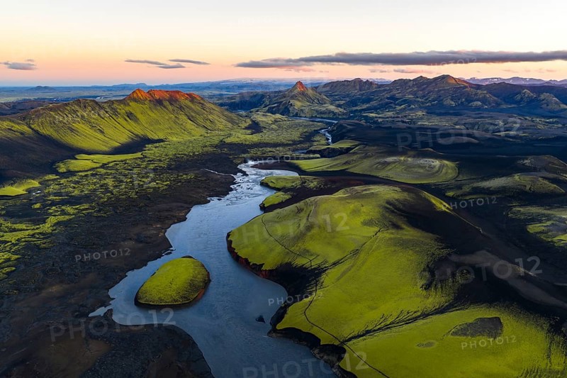 Moss-covered landscape with mountains and river in the Icelandic Highlands, Iceland