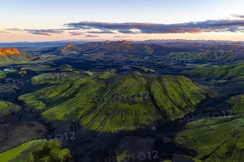 Moss-covered landscape with mountains in the Icelandic Highlands, Iceland
