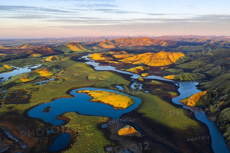 Mossy landscape and lakes at sunrise, Icelandic Highlands, Iceland