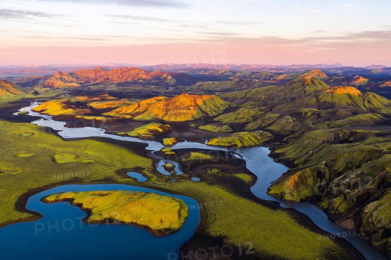 Mossy landscape and lakes at sunrise, Icelandic Highlands, Iceland