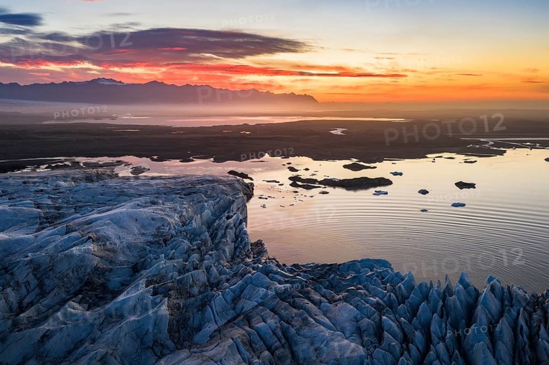 Glacier with Fjallsarlon glacier lagoon at sunrise, Vatnajökull National Park, South Iceland, Iceland