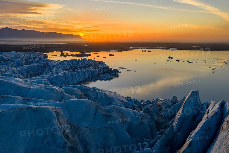 Glacier with Fjallsarlon glacier lagoon at sunrise, Vatnajökull National Park, South Iceland, Iceland