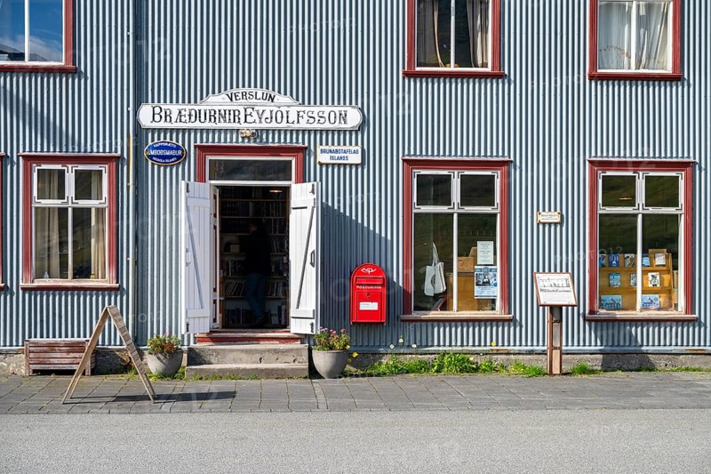 Shop window and entrance of the old bookshop in Flateyri, Westfjords, West Iceland, Iceland