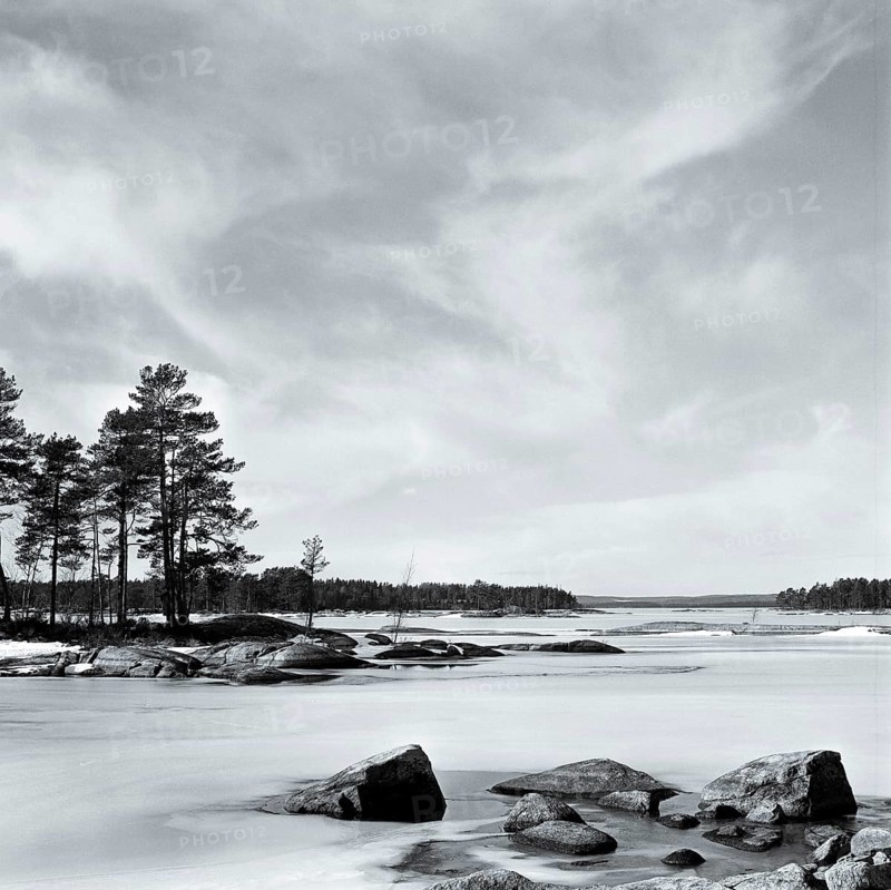 Lake Stora Gla in winter, frozen, with rocks and islands, black and white, analogue, Värmland, Sweden