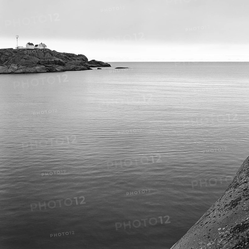 North Sea, Skagerrak, behind a rock with lonely white houses, black and white, analogue, Bohuslän, Västra Götaland, Sweden