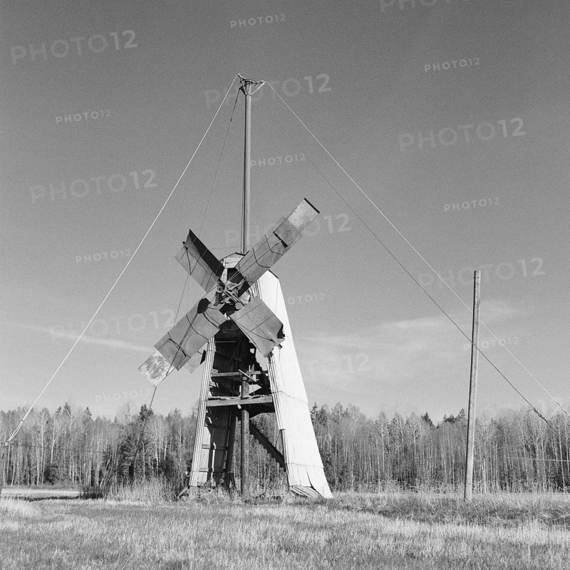 Old broken windmill in a field, black and white, analogue, Tysslingen, Örebro, Sweden