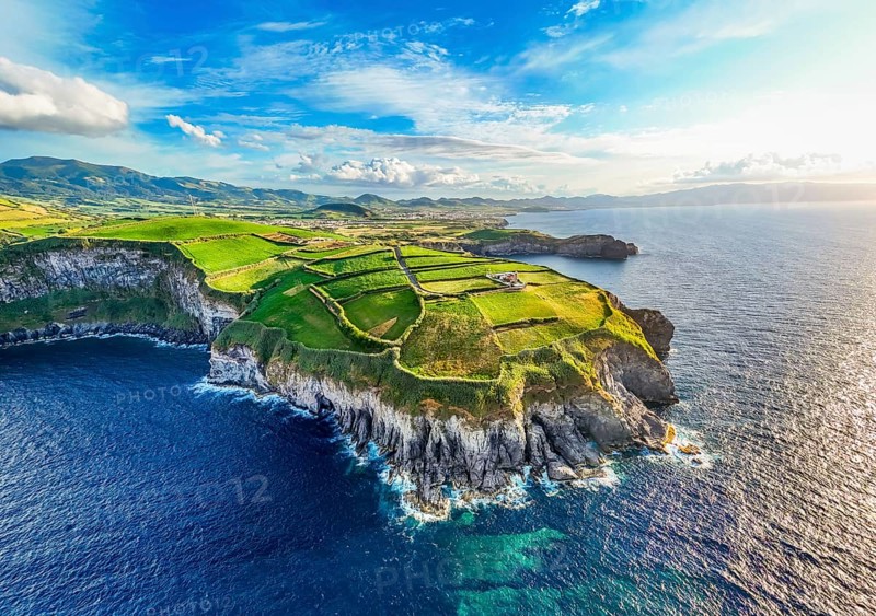 Panorama of Cape Cintrao, Cliffs, Green Hills, Fields with Pasturelands and Atlantic Ocean. Azores, Sao Miguel Island. Portugal. Aerial View