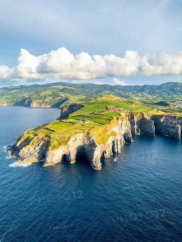 Cape Cintrao, Cliffs, Green Lush Hills, Fields, Pasturelands and Atlantic Ocean. Azores, Sao Miguel Island. Portugal. Aerial View