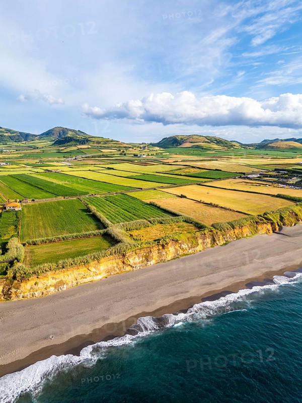 Santa Barbara Beach, Green Lush Fields with Pasturelands and Atlantic Ocean. Azores, Sao Miguel Island. Portugal. Aerial View