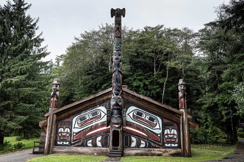 Totem poles at a Tlingit Clan House, Totem Bight State Historical Park, Ketchikan, Alaska, USA