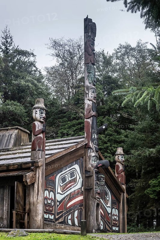 Totem poles at a Tlingit Clan House, Totem Bight State Historical Park, Ketchikan, Alaska, USA