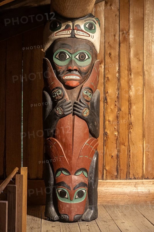 Totem poles in a Tlingit Clan House, Totem Bight State Historical Park, Ketchikan, Alaska, USA