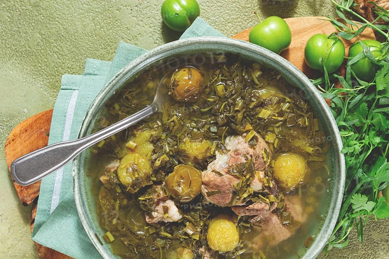Chakapuli, Georgian dish, stewed meat with herbs and tkemali, in white wine, homemade, no people