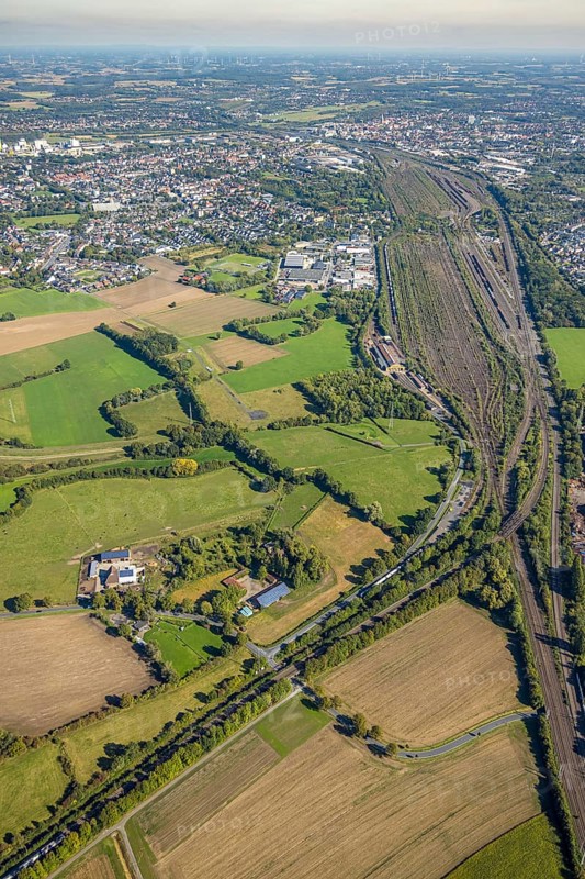 Aerial view, Hamm marshalling yard, Schieferstraße industrial estate with a view of the city centre, Pelkum district, Hamm, Ruhr area, North Rhine-Westphalia, Germany, railway area, DE, Deutsche Bahn AG, Europe, commercial enterprise, commercial area, commercial property, commercial site, commercial use, railway tracks, tracks, property tax, goods trains, real estate, industrial area, industrial site, aerial view, aerial photography, aerial photography, overview, bird's-eye view, residential area, housing and living, residential area, residential quality, residential neighbourhood, housing estate, residential district, birds-eyes view, overview