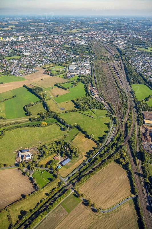 Aerial view, Hamm marshalling yard, Schieferstraße industrial estate with a view of the city centre, Pelkum district, Hamm, Ruhr area, North Rhine-Westphalia, Germany, railway area, DE, Deutsche Bahn AG, Europe, commercial enterprise, commercial area, commercial property, commercial site, commercial use, railway tracks, tracks, property tax, goods trains, real estate, industrial area, industrial site, aerial view, aerial photography, aerial photography, overview, bird's-eye view, residential area, housing and living, residential area, residential quality, residential neighbourhood, housing estate, residential district, birds-eyes view, overview