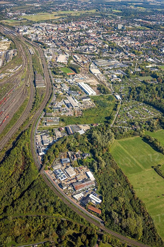 Aerial view, commercial area Östingstraße and view to the main railway station with city centre, transmitter Hamm telecommunication tower, district Pelkum, Hamm, Ruhr area, North Rhine-Westphalia, Germany, railway area, railway station, DE, Deutsche Bahn AG, Europe, commercial enterprise, commercial area, commercial area, commercial property, commercial site, commercial use, railway tracks, tracks, main station, main railway station, industrial area, industrial site, aerial view, aerial photography, aerial photography, tower, overview, bird's-eye view, overview