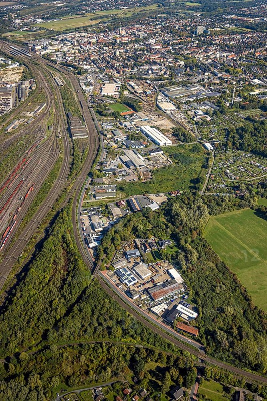 Aerial view, commercial area Östingstraße and view to the main railway station with city centre, transmitter Hamm telecommunication tower, district Pelkum, Hamm, Ruhr area, North Rhine-Westphalia, Germany, railway area, railway station, DE, Deutsche Bahn AG, Europe, commercial enterprise, commercial area, commercial area, commercial property, commercial site, commercial use, railway tracks, tracks, main station, main railway station, industrial area, industrial site, aerial view, aerial photography, aerial photography, tower, overview, bird's-eye view, overview