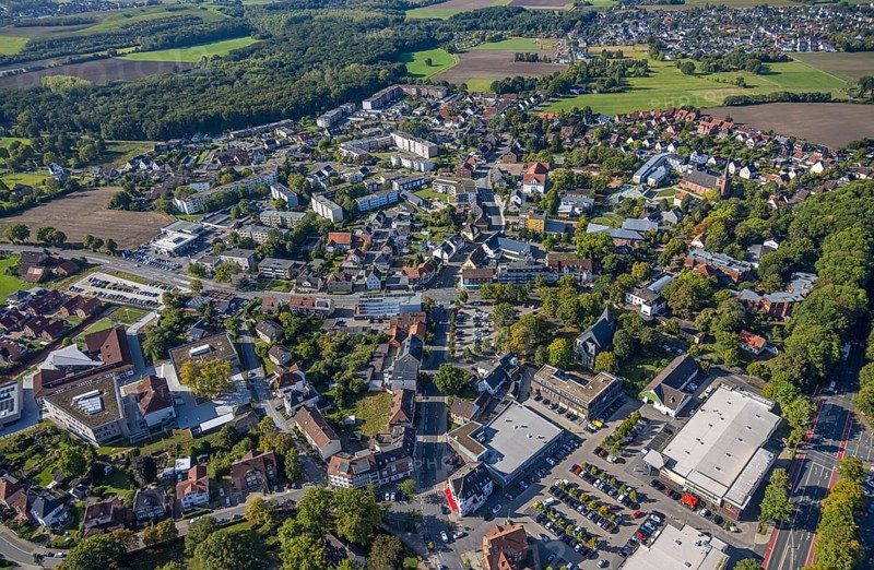 Aerial view, Herringen centre, shopping centre Herringen with supermarket DM, Edeka Weber and Aldi, protestant church Sankt-Viktor-Kirche, in the back Caritas-Altenheim St. Josef and Heilig Kreuz Kirche, Herringen district, Hamm, Ruhr area, North Rhine-Westphalia, Germany, retirement home, old people's home, place of worship, care and nursing, DE, shopping, shopping centre, shopping square, shopping mall, Europe, religious community, place of worship, property tax, holy place, real estate, church, parish, denomination, aerial view, aerial photography, aerial photography, local supply centre, care facility, religion, religious site, retirement home, retirement residence, retirement home, senior citizens' centre, shopping centre, supermarket, overview, bird's-eye view, residential complex, housing and living, residential area, residential quality, residential quarter, housing estate, residential district, birds-eyes view, overview