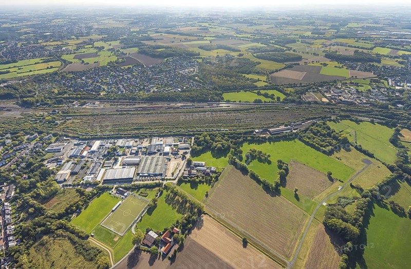 Aerial view, marshalling yard Hamm, industrial area Schieferstraße and residential area district Lohauserholz, distant view with meadows and fields, district Pelkum, Hamm, Ruhr area, North Rhine-Westphalia, Germany, railway area, DE, Deutsche Bahn AG, Europe, commercial enterprise, commercial area, commercial property, commercial location, commercial use, railway tracks, tracks, property tax, goods trains, real estate, industrial area, industrial site, aerial view, aerial photography, aerial photography, overview, bird's-eye view, residential area, housing and living, residential area, residential quality, residential neighbourhood, housing estate, residential district, birds-eyes view, overview