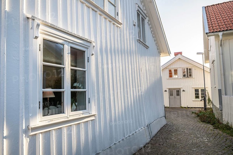 White wooden houses in the alleyways of Smögen, Smögenbryggan, Västra Götalands Län, Bohuslän, Sweden